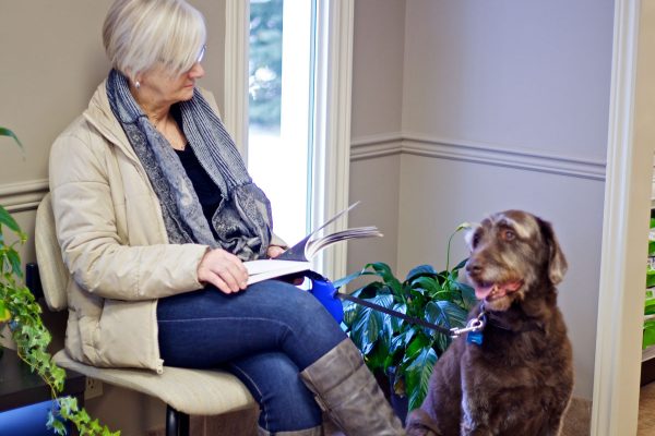 woman and dog in Waiting Room