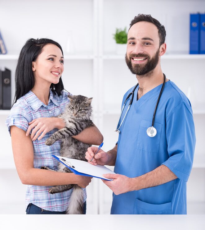 woman with her cat visit vet